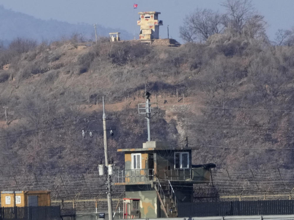Military guard posts of North Korea, rear, and South Korea, front, are seen in Paju, near the border with North Korea, South Korea, Sunday, Jan. 2, 2022.