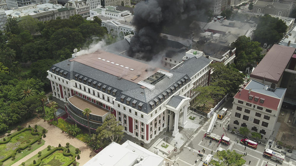 This photo supplied by the City of Cape Town shows smoke rising from the Houses of Parliament, in Cape Town, South Africa, on Sunday.