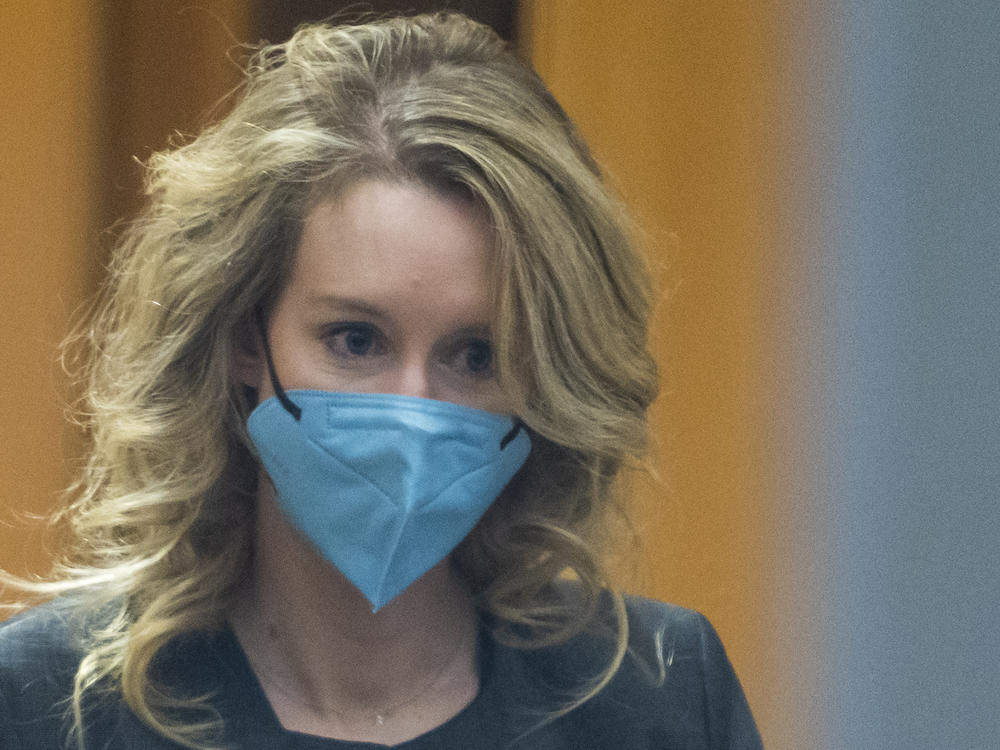 Elizabeth Holmes walks into federal court in San Jose, Calif.