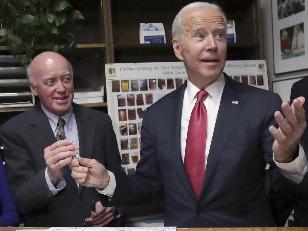 New Hampshire Secretary of State Bill Gardner, left, takes a pen from then-presidential candidate Joe Biden after he filed to have his name listed on the New Hampshire primary ballot on Nov. 8, 2019.