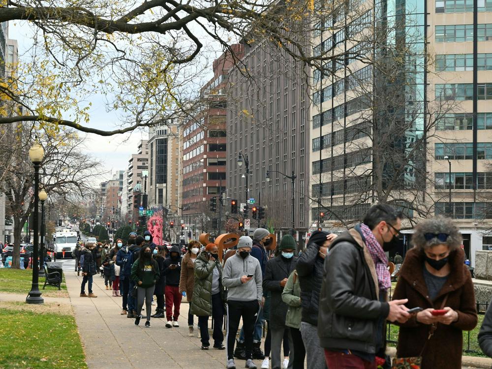 People line up to get tested for COVID-19 in Washington, D.C., on Wednesday. More than 1 million positive COVID-19 tests were recorded in the U.S. on Monday, according to data from Johns Hopkins University.