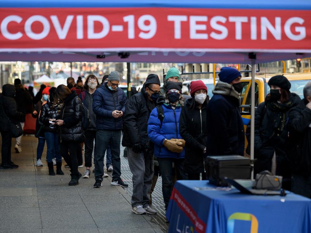 People wait in line to receive a COVID-19 test on Tuesday in New York. The U.S. recorded more than 1 million COVID-19 cases on Monday.