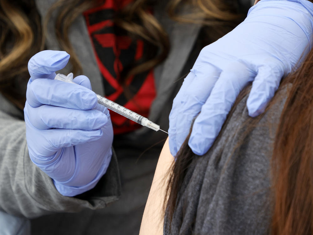 A woman receives a booster shot at a pop-up vaccination clinic in Las Vegas on Dec. 21.