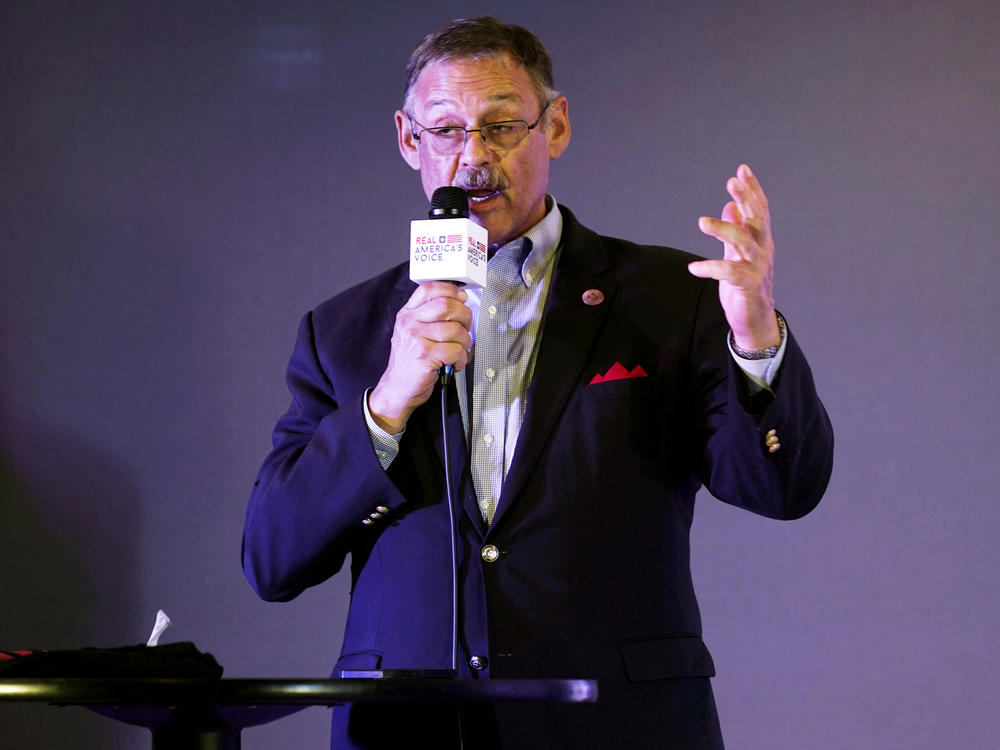 Rep. Mark Finchem, of Arizona, gestures as he speaks during an election rally in Richmond, Va., in October.