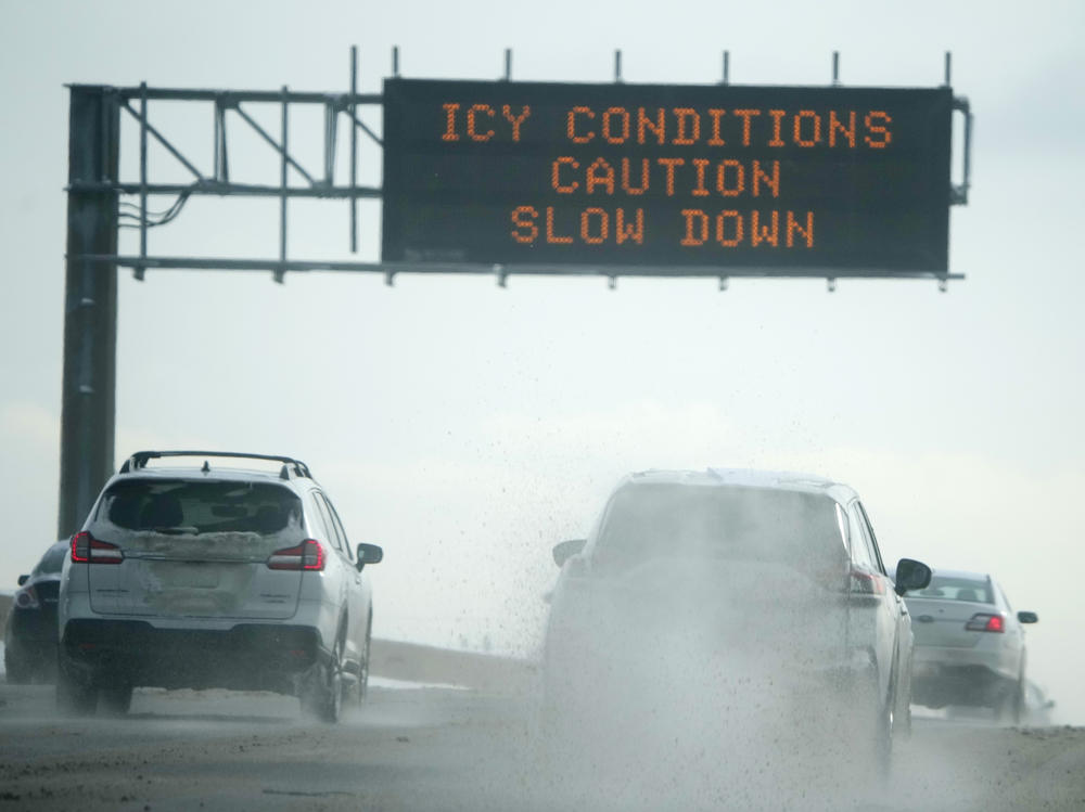 Motorists travel along the southbound lanes of Interstate 25 in Denver after a winter storm dropped up to a foot of snow in the metropolitan area on Jan. 1.