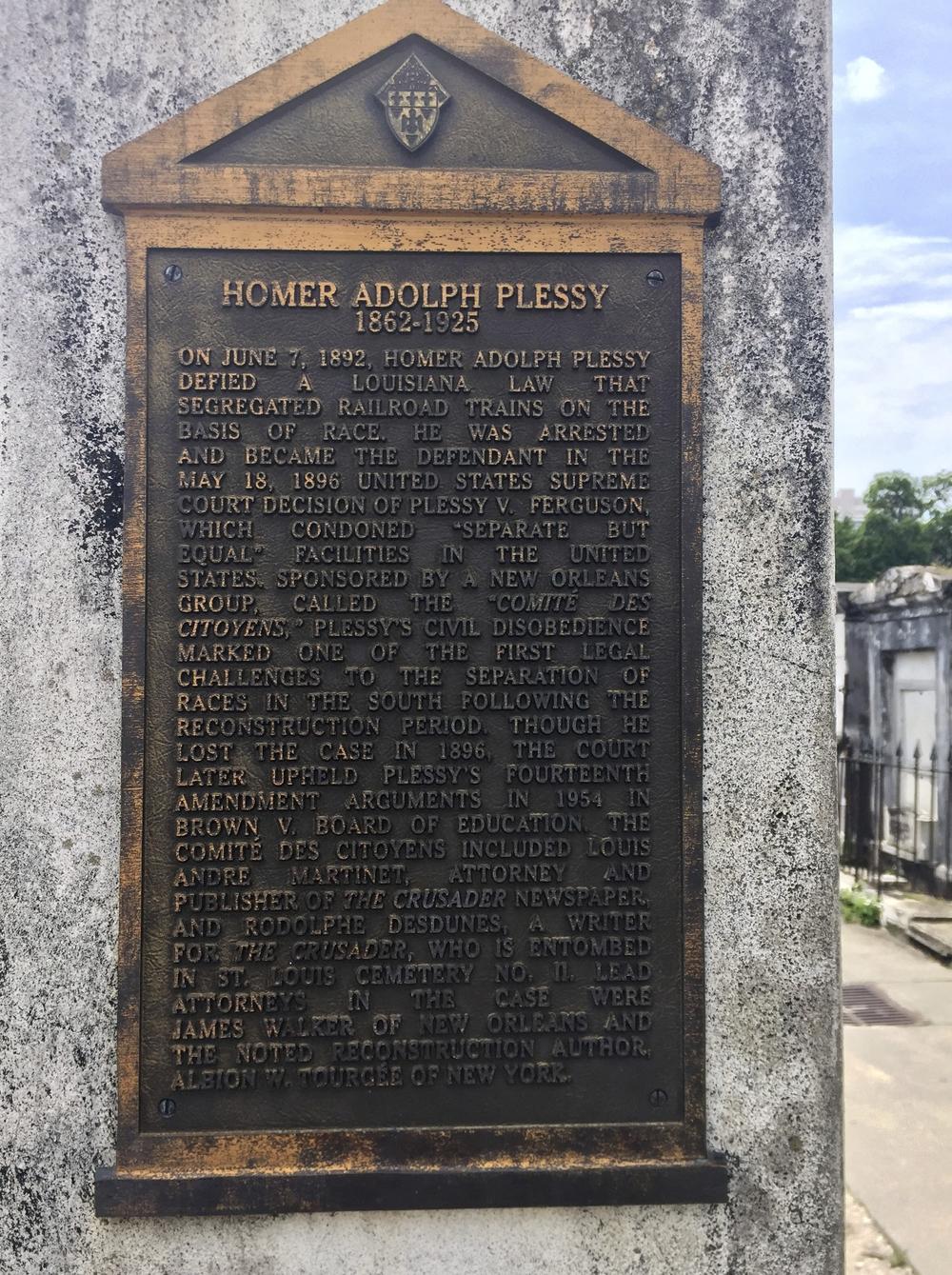 This June 3, 2018 photo shows a marker on the burial site for Homer Plessy at St. Louis No. 1 Cemetery in New Orleans.