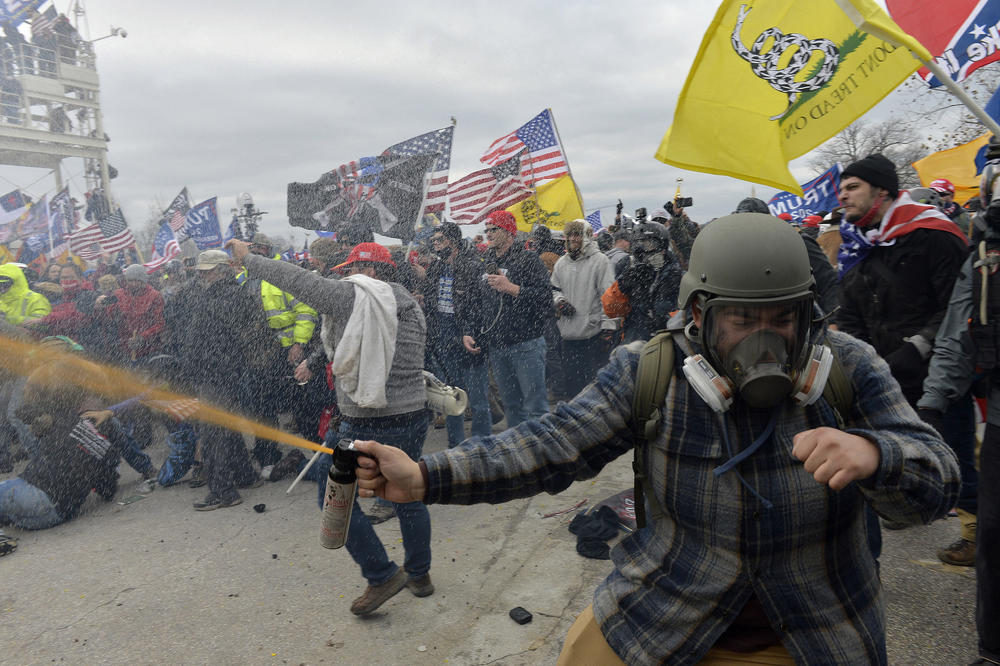 Trump supporters clash with police and security forces before pushing past law enforcement and barriers to enter the Capitol.