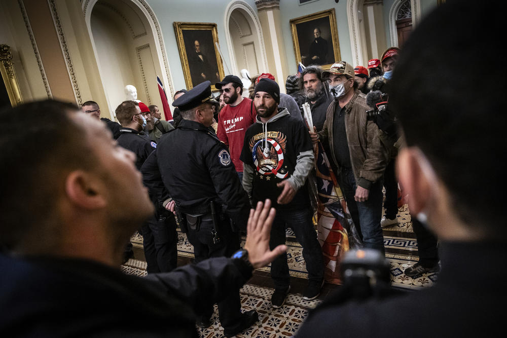 Protesters interact with Capitol Police officers inside the U.S. Capitol Building. Some of these interactions turned violent, with deadly consequences.