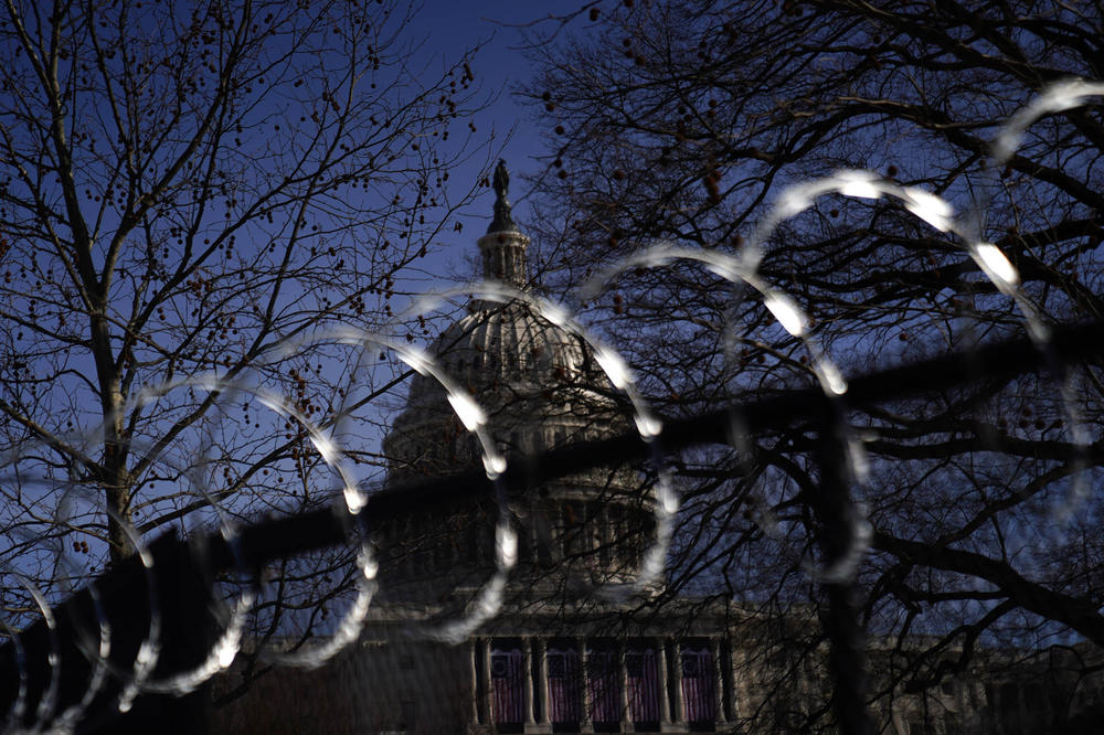 Concertina wire tops security fencing around the U.S. Capitol on Jan. 16, 2021.