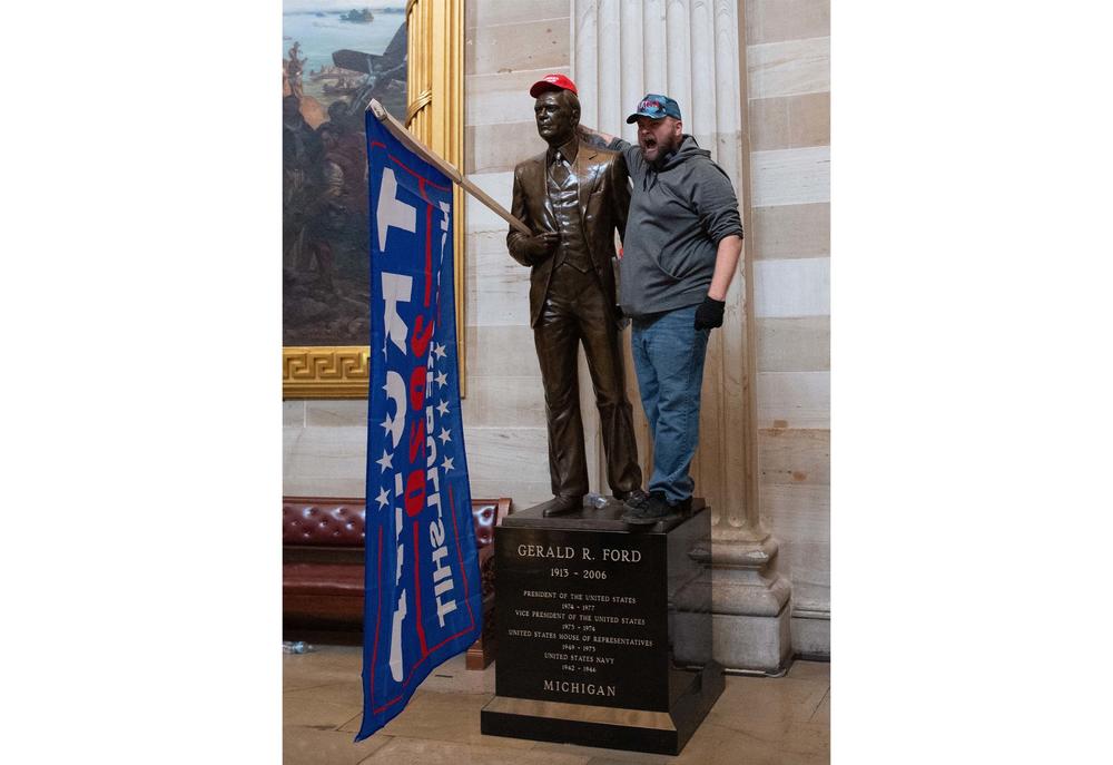 The hallowed halls of the Capitol Rotunda became a backdrop for Trump supporters' videos and photos — and the statues were treated as props.