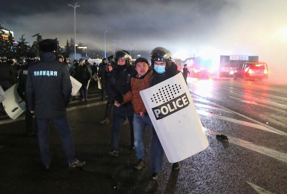 Kazakh law enforcement officers detain a man during a protest in Almaty on Wednesday.