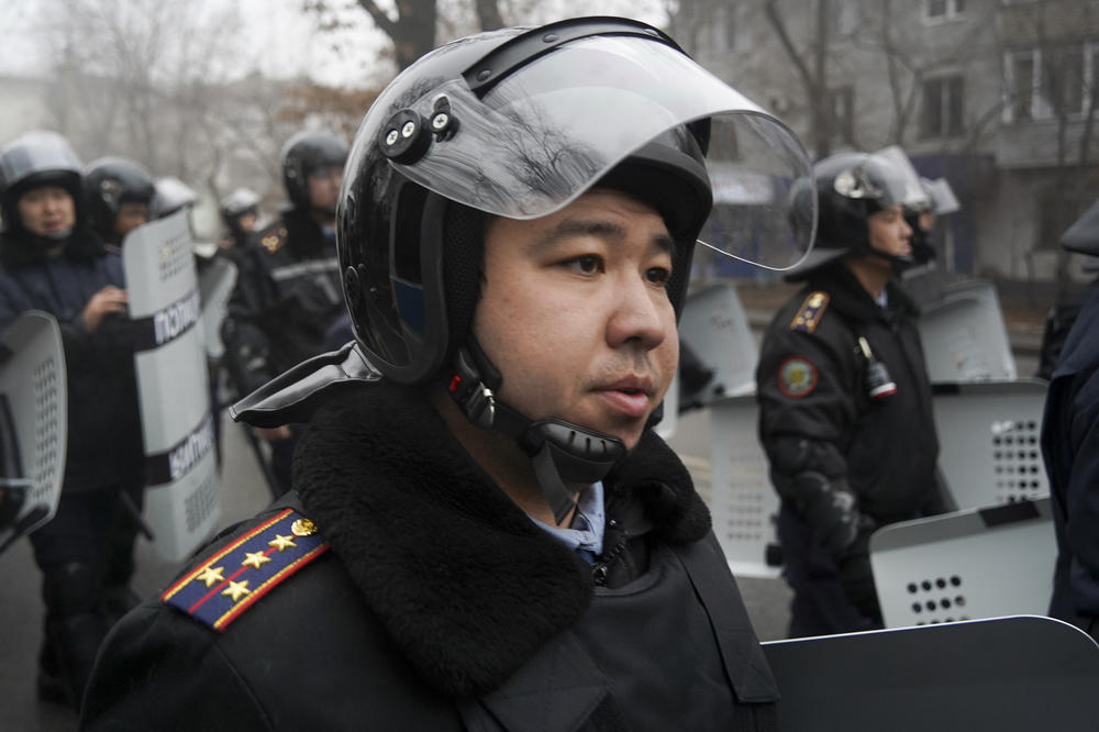 A riot police officer stands ready to stop demonstrators during a protest in Almaty, Kazakhstan, on Wednesday.