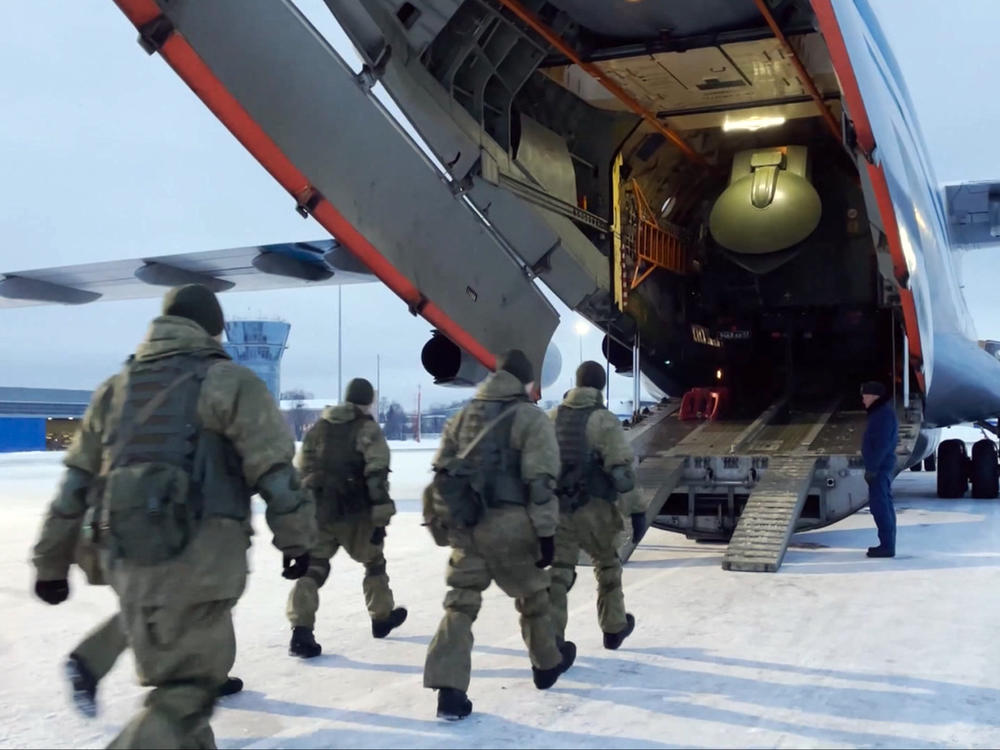 In this photo taken from video, Russian peacekeepers board a Russian military plane at an airfield outside Moscow to fly to Kazakhstan on Thursday. A Russia-led military alliance, the Collective Security Treaty Organization, said early Thursday that it would send peacekeeper troops to Kazakhstan.