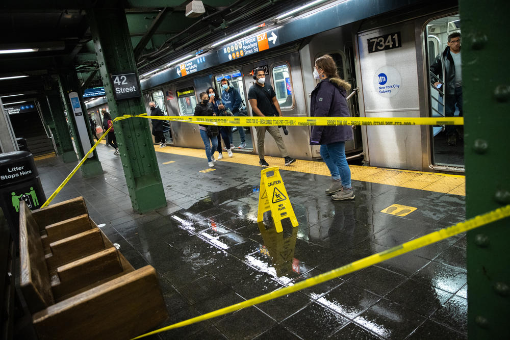 A flooded floor is blocked off in the 42nd Street Times Square subway station during a rain storm in New York on Oct. 26, 2021. New York City commuters faced a blustery, soaked-to-the-skin trek to work Tuesday as a powerful coastal storm unwound across the Northeast.