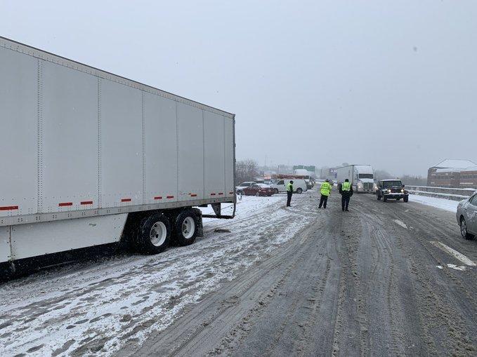 Tennessee Highway Patrol officers respond to a crash on Interstate 65 involving seven passenger cars and two commercial vehicles.