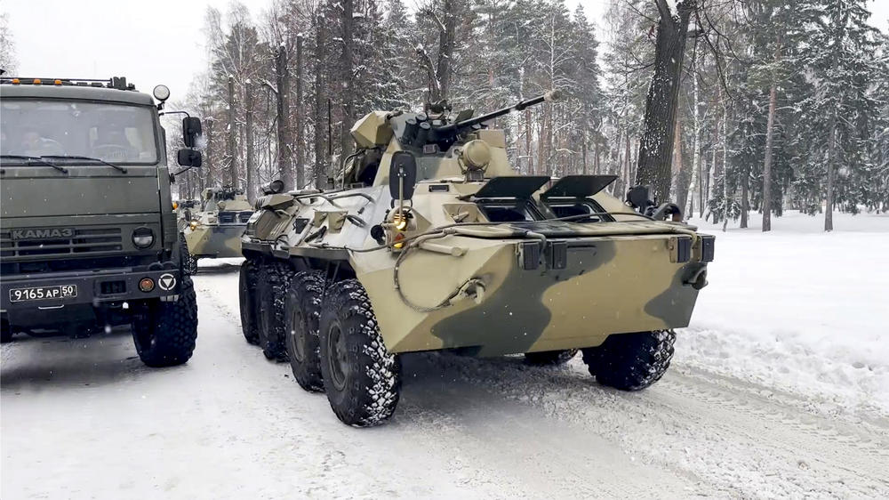 In this photo taken from video released by the Russian Defense Ministry Press Service, military vehicles of Russian peacekeepers are parked waiting to be uploaded on Russian military planes at an airfield outside Moscow to fly to Kazakhstan on Thursday.