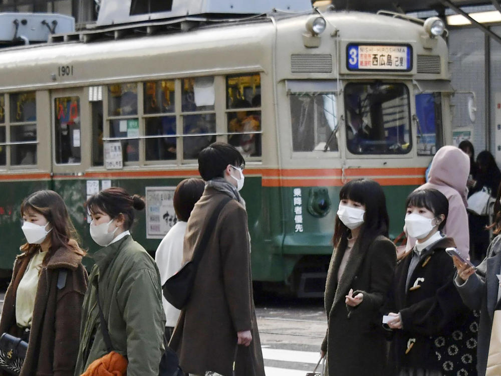 Japan approved new restrictions on Friday to curb a sharp rise in coronavirus cases in the three most affected southwestern regions of Okinawa, Yamaguchi and Hiroshima.