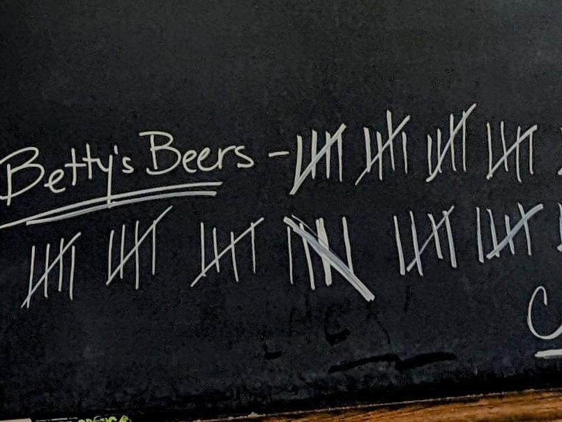 A tally on the chalkboard at Commerce Street Brewery in Mineral Point, Wis., shows that people have bought more than 110 beers for the late comedian Betty White.