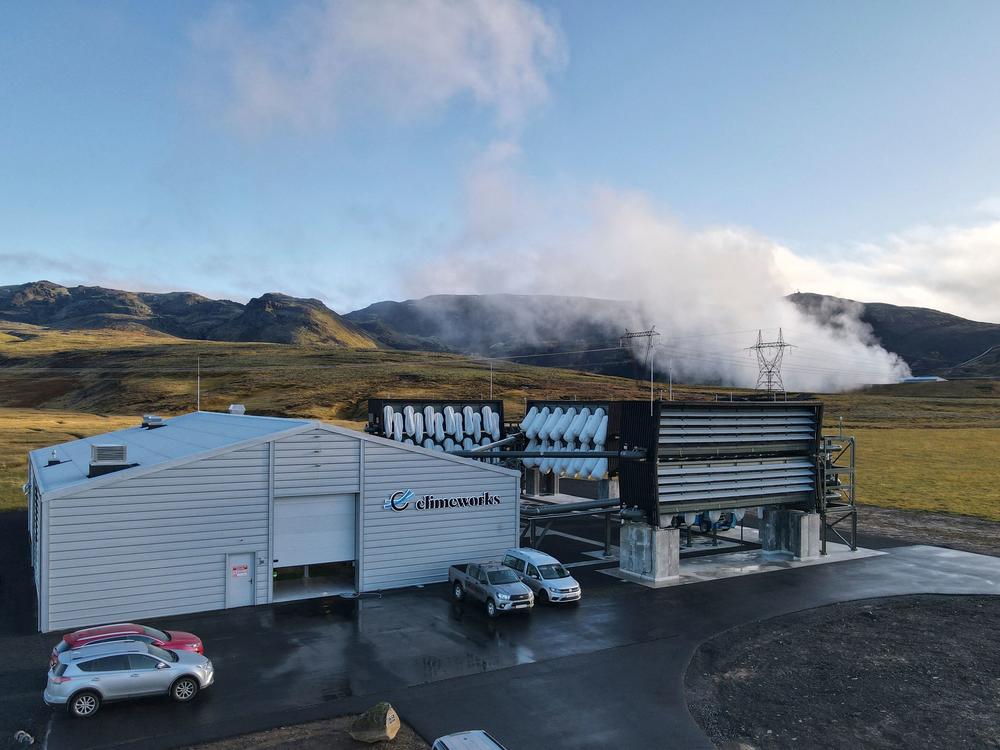 Climeworks factory with it's fans in front of the collector, drawing in ambient air and release it, as largely purified CO2 through ventilators at the back is seen at the Hellisheidi power plant near Reykjavik on October 11, 2021.