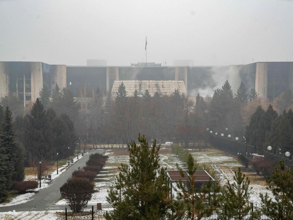 The burned-out administrative building in Almaty, Kazakhstan's largest city, can be seen Friday. The country's president has rejected calls for talks with protesters after days of unprecedented unrest, vowing to destroy 
