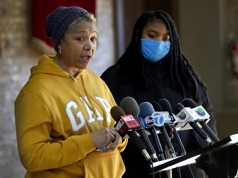 Cheri Warner (left) stands with her daughter, Brea, and speaks on Monday to fall for the Chicago school district and teacher's union to focus on getting students back in the classroom in Chicago.