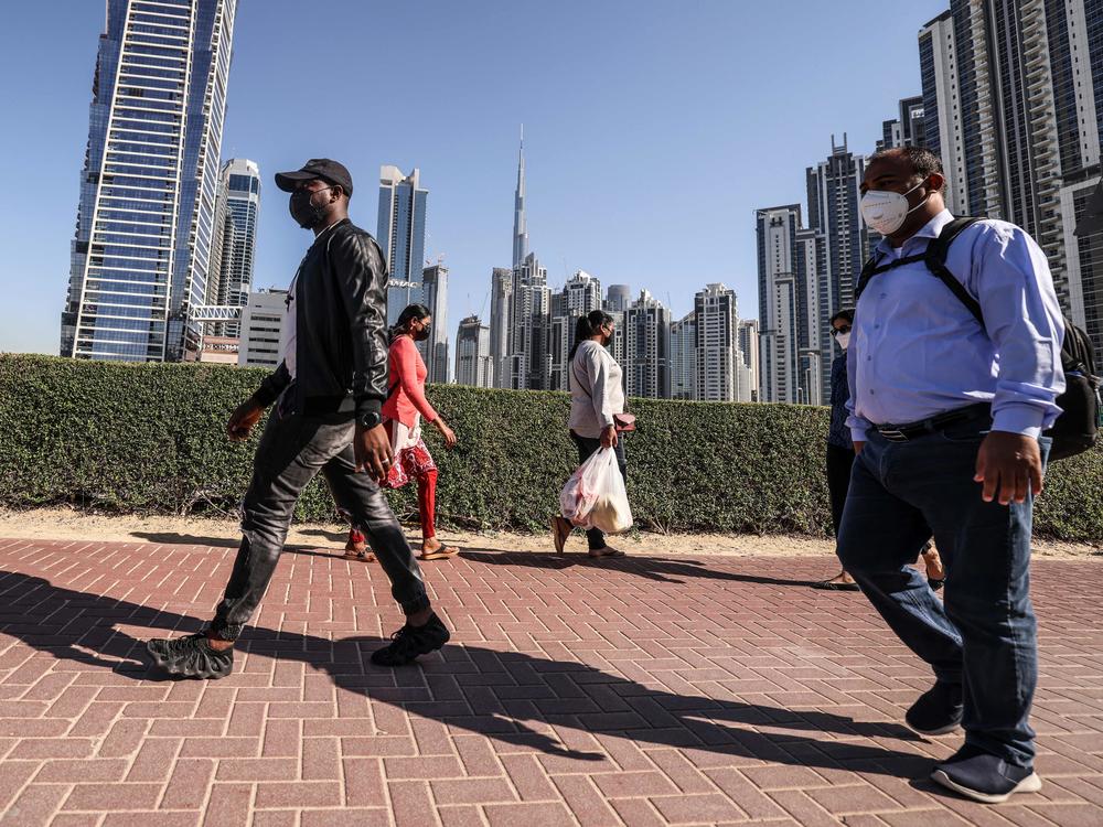 Employees walk to work on the first working Friday in Dubai, on Jan. 7. The United Arab Emirates has changed its workweek, making Sunday, which is a workday in many Muslim countries, now part of the weekend.