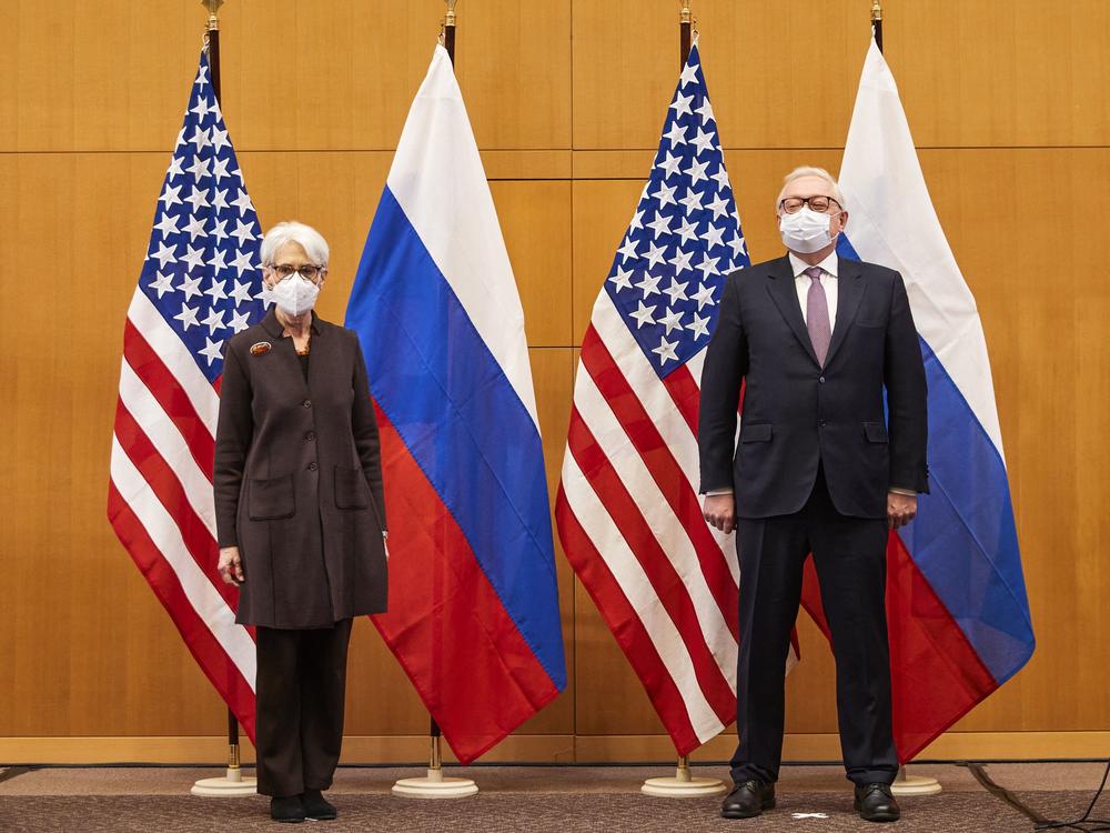 U.S. Deputy Secretary of State Wendy Sherman (left) and Russian deputy Foreign Minister Sergei Ryabkov (right) pose for pictures as they attend security talks on soaring tensions over Ukraine, at the U.S. permanent Mission, in Geneva on Jan. 10.