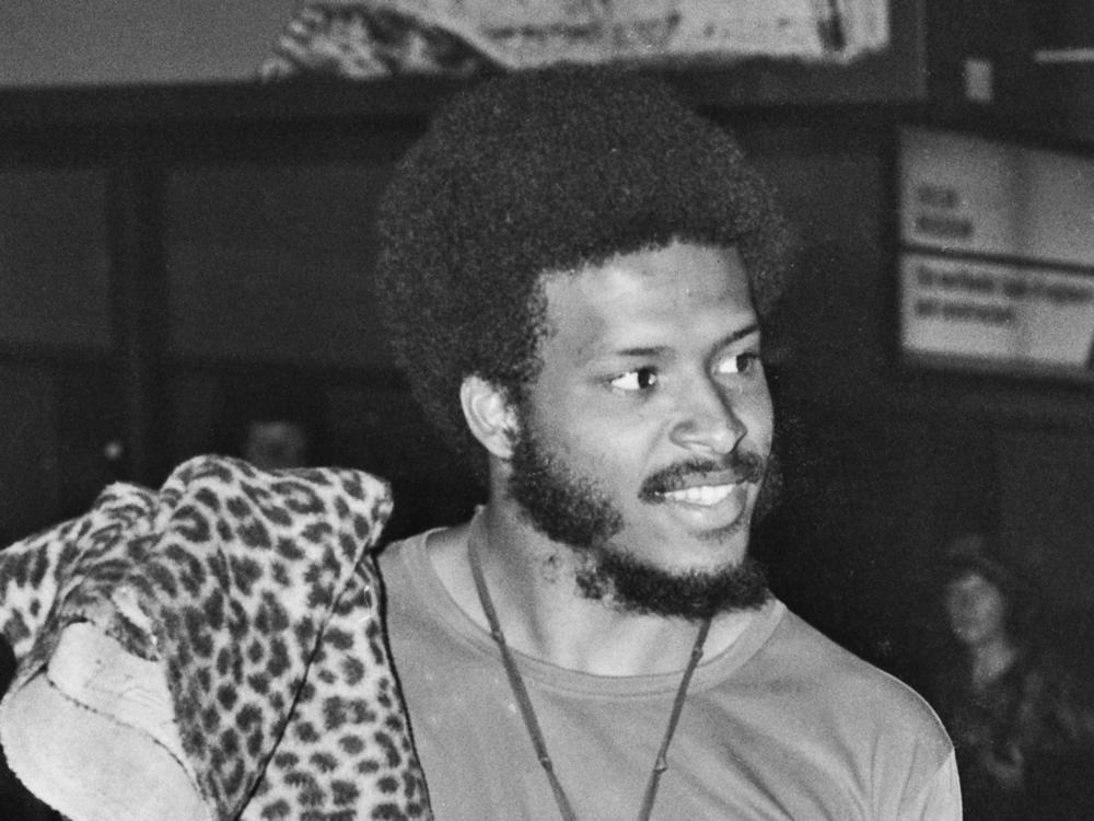 James Mtume, left, and Miles Davis arrive at Heathrow Airport in London on July 10, 1973.