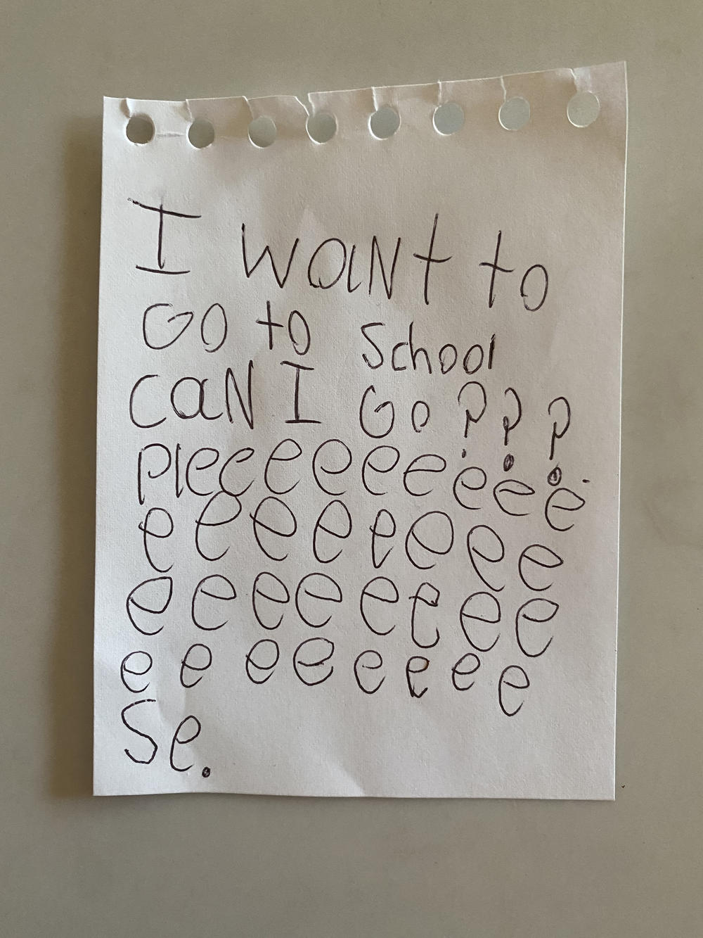 The note that Caroline Tung Richmond's daughter gave her mom asking if she could please go to in-person school.