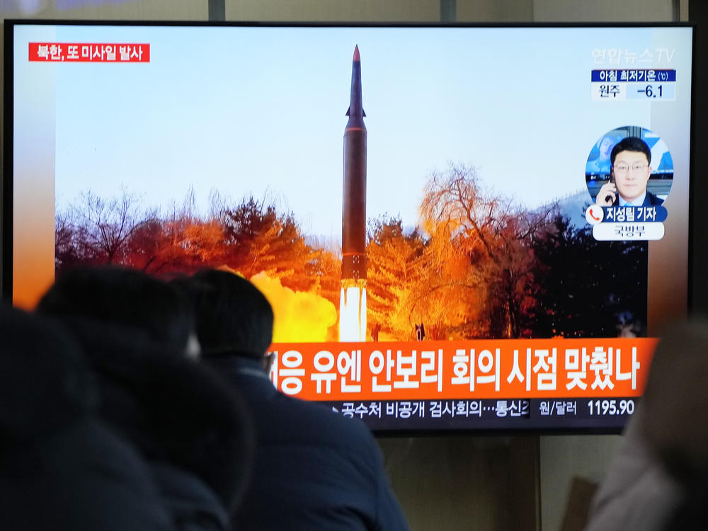 People watch a TV showing a file image of North Korea's missile launch during a news program at the Seoul Railway Station in Seoul, South Korea, on Tuesday.