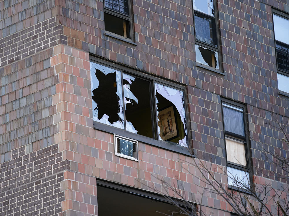 Windows in the apartment building are shattered following the fire.