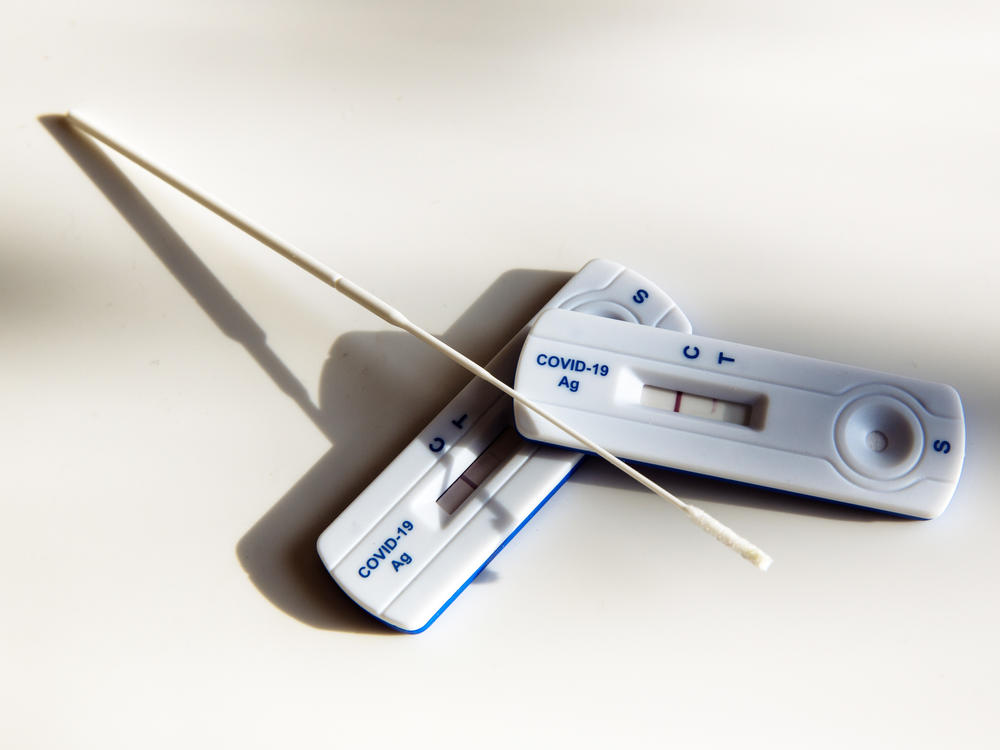 A COVID-19 home test in the U.S. comes with a swab to swirl in the nostrils. But some users say they're swabbing the throat too — even though that's not what the instructions say to do. 