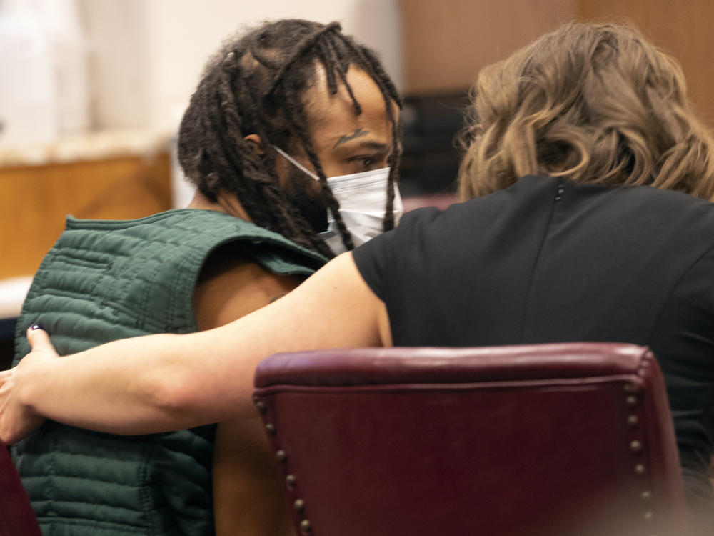 Darrell Brooks, left, speaks with a lawyer during a court appearance on Nov. 23, 2021 in Waukesha County Court in Waukesha, Wis. Brooks is now facing new charges related to the Christmas parade tragedy.