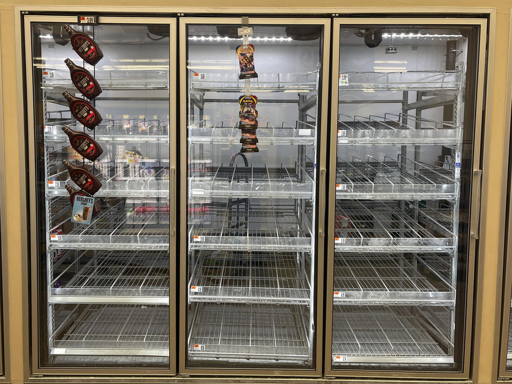 The milk shelf is mostly empty at a Giant grocery store on Tuesday in Washington, D.C.