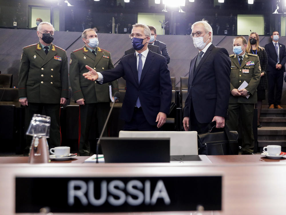 NATO Secretary-General Jens Stoltenberg (center) and Russia's Deputy Foreign Minister Alexander Grushko arrive for the NATO-Russia Council at NATO headquarters, in Brussels, Wednesday. Senior NATO and Russian officials met to try to bridge differences over the future of Ukraine.