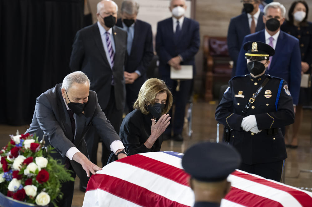 House Speaker Nancy Pelosi  and Senate Majority Leader Charles Schumer pay their respects at Harry Reid's casket.
