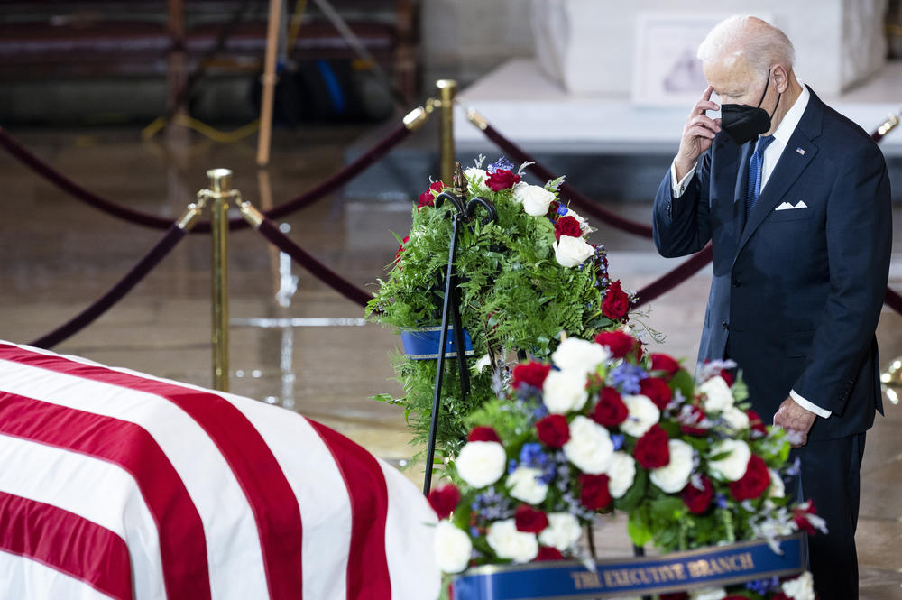 President Joe Biden pays his respects to former Senate Majority Leader Harry Reid in the Rotunda of the U.S. Capitol as Reid lies in state on Wednesday.