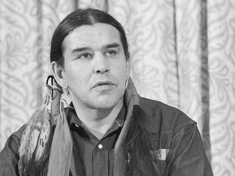 Clyde Bellecourt, head of the American Indian Movement, speaks at a press conference in New York in 1973. Bellecourt and two physicians, Alan Berkman and Barbara Zeller, had just returned from Wounded Knee, S.D., where AIM led a 50-day takeover.
