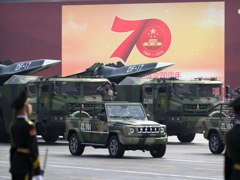 Chinese military vehicles carrying DF-17 ballistic missiles roll during a parade to commemorate the 70th anniversary of the founding of Communist China in Beijing, Tuesday, Oct. 1, 2019.