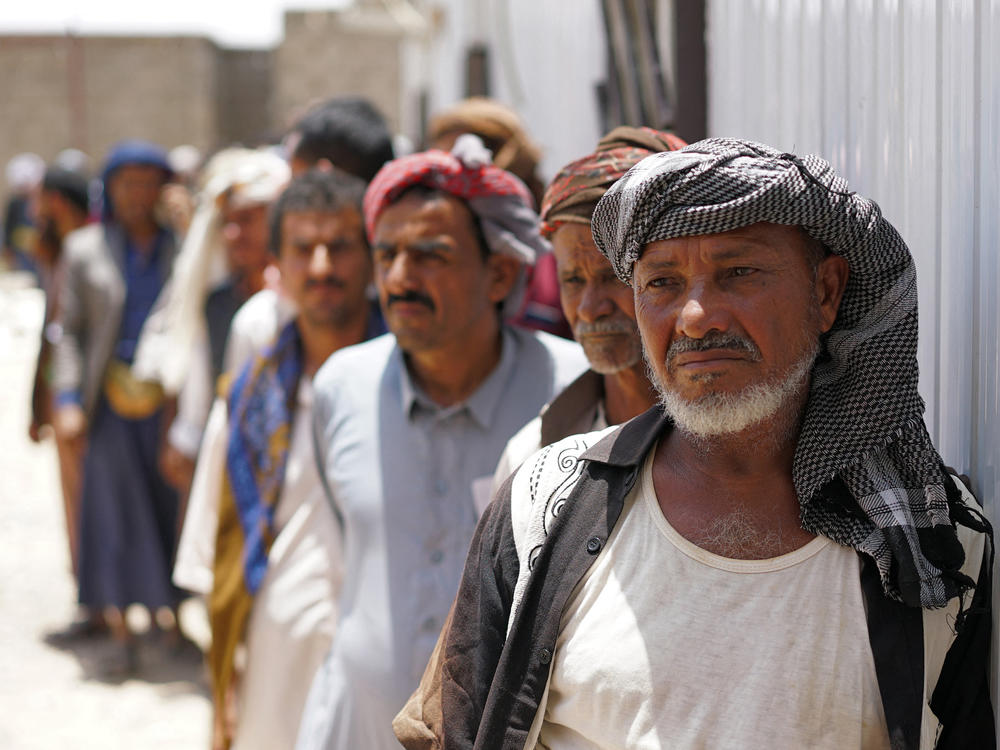 Yemenis queue up to receive a dose of the AstraZeneca COVID-19 vaccine at a center on the outskirts of Yemen's embattled province of Marib. Yemen is one of 36 countries with a vaccination rate below 10%.