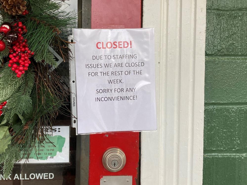 A closed sign is taped to the door of the Main Street Pub in Clifton, Va., last month.