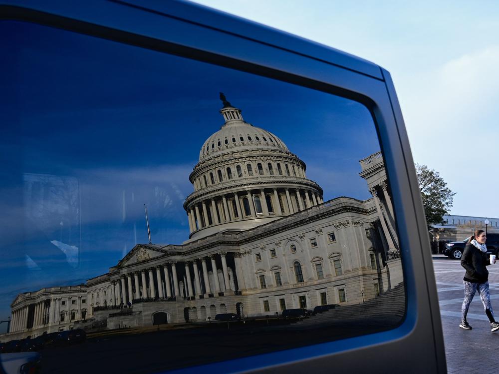 A reflection of the U.S. Capitol on a car window on Jan. 13, the day President Biden met with Senate Democrats to talk about voting rights legislation.