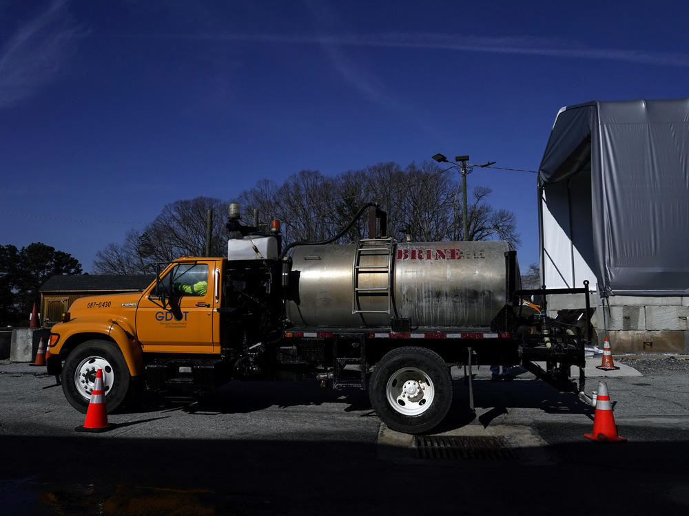 A Georgia Department of Transportation brine tank is filled Friday in Forest Park, Ga., ahead of a winter storm that's poised to drop several inches of snow across the South