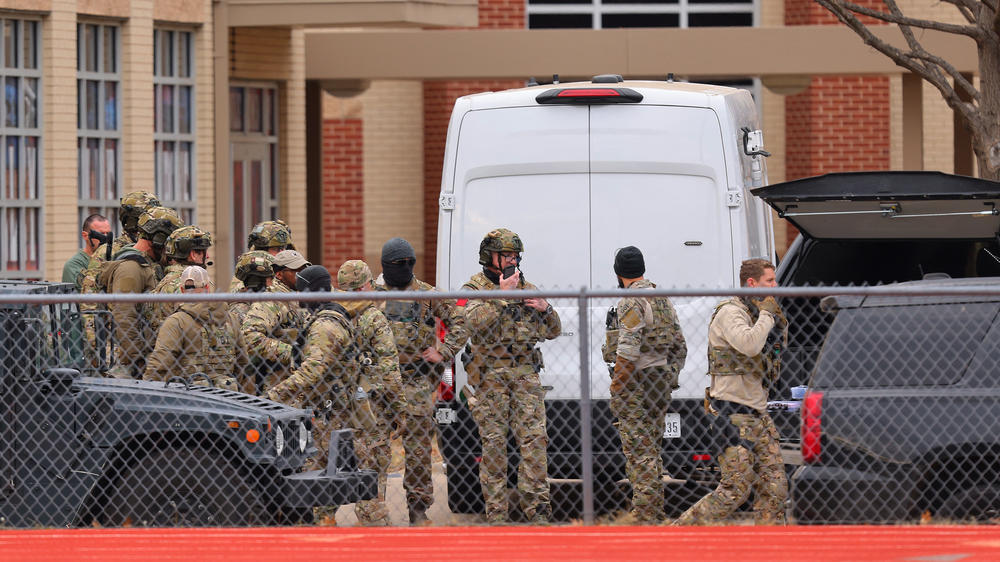 SWAT team members deploy near the Congregation Beth Israel Synagogue in Colleyville, Texas, near Dallas, on Saturday.