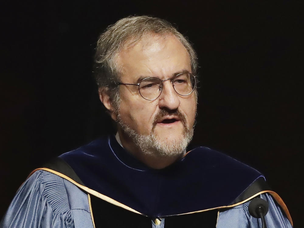 In this Jan. 30 2017, file photo, University of Michigan President Mark Schlissel speaks during a ceremony at the university, in Ann Arbor, Mich. Schlissel has been removed as president of the University of Michigan due to the alleged 