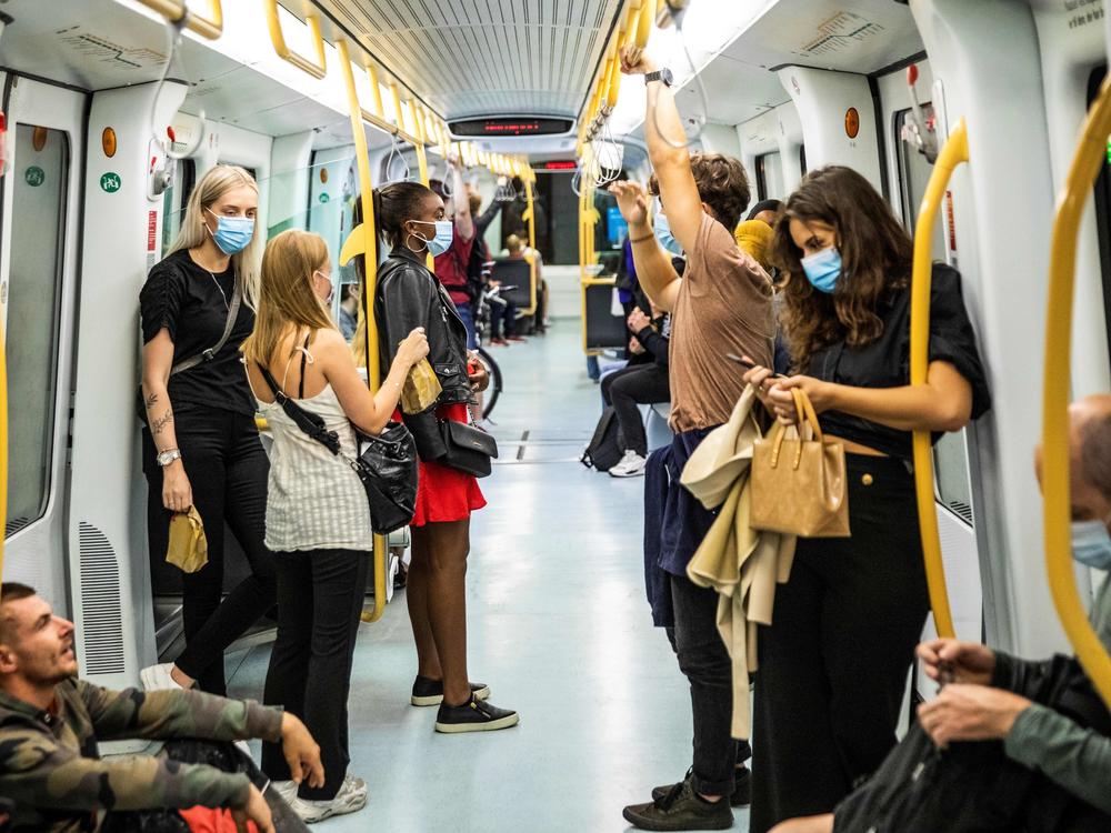 People are seen wearing masks on a metro train in Copenhagen. Another one of Dr. Kluge's pandemic stabilizers is doubling the amount of people wearing masks indoors.