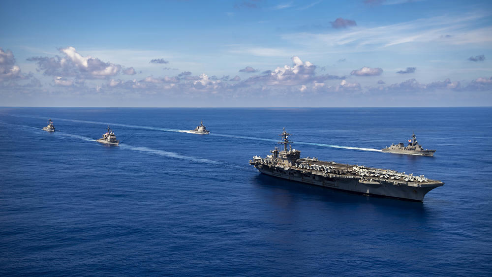 The Nimitz-class aircraft carrier USS Carl Vinson (CVN 70), the Ticonderoga-class guided-missile cruiser USS Lake Champlain (CG 57) and the Arleigh Burke-class guided-missile destroyer USS Chafee (DDG 90) conduct a passing honors ceremony with Japan's Murasame-class destroyer JS Ikazuchi (DD 107) and the Kongo-class guided-missile destroyer JS Chokai (DDG 176) in the Pacific Ocean, Sept. 19, 2021.