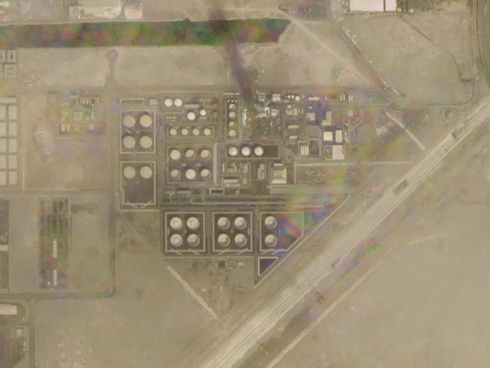 In this satellite image provided by Planet Labs PBC, smoke rises over an Abu Dhabi National Oil Co. fuel depot in the Mussafah neighborhood of Abu Dhabi, United Arab Emirates, Monday, Jan. 17, 2022.