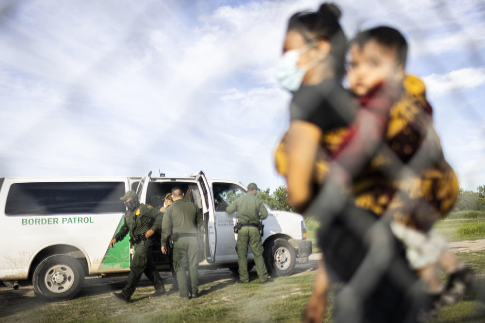 Central American migrants are apprehended by U.S. Customs and Border Protection agents after crossing the Rio Grande in LaJoya, Texas, on June 12, 2021.