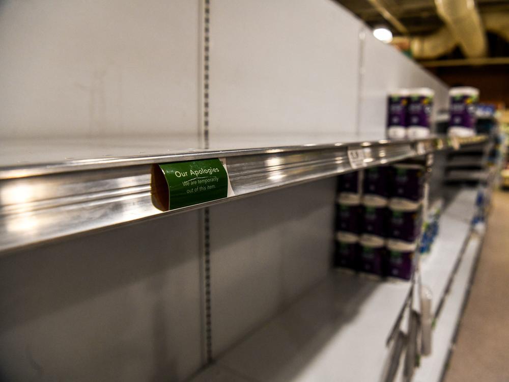 Toilet paper and paper towels shelves are mainly empty at a supermarket in Miami Beach, Fl., on Jan. 13. Staffing shortages tied to the omicron variant and continued supply chain disruptions have led to shortages of some goods at many supermarkets.